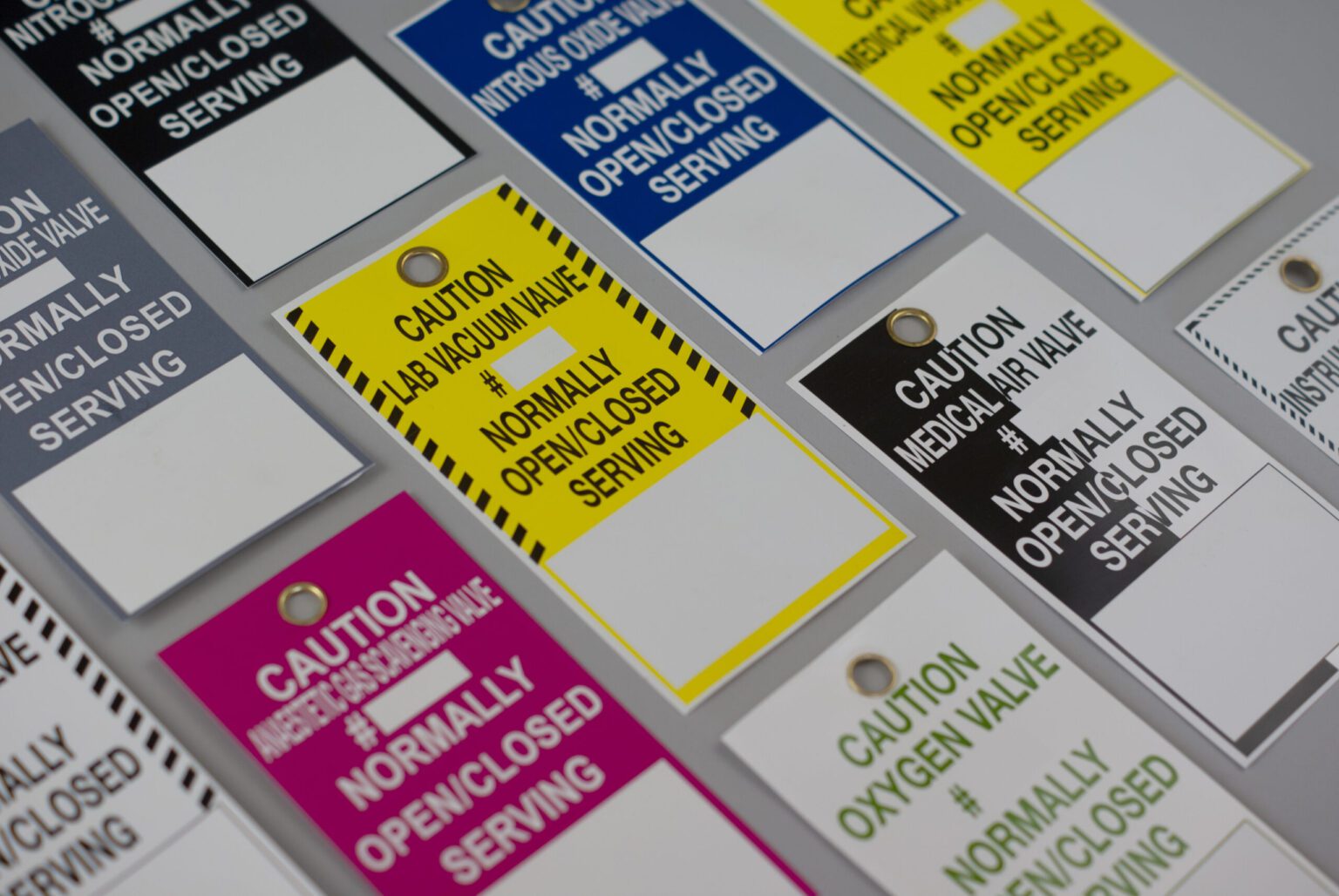 Multiple rectangular medical tags in different colors and legends showcasing the variety possible