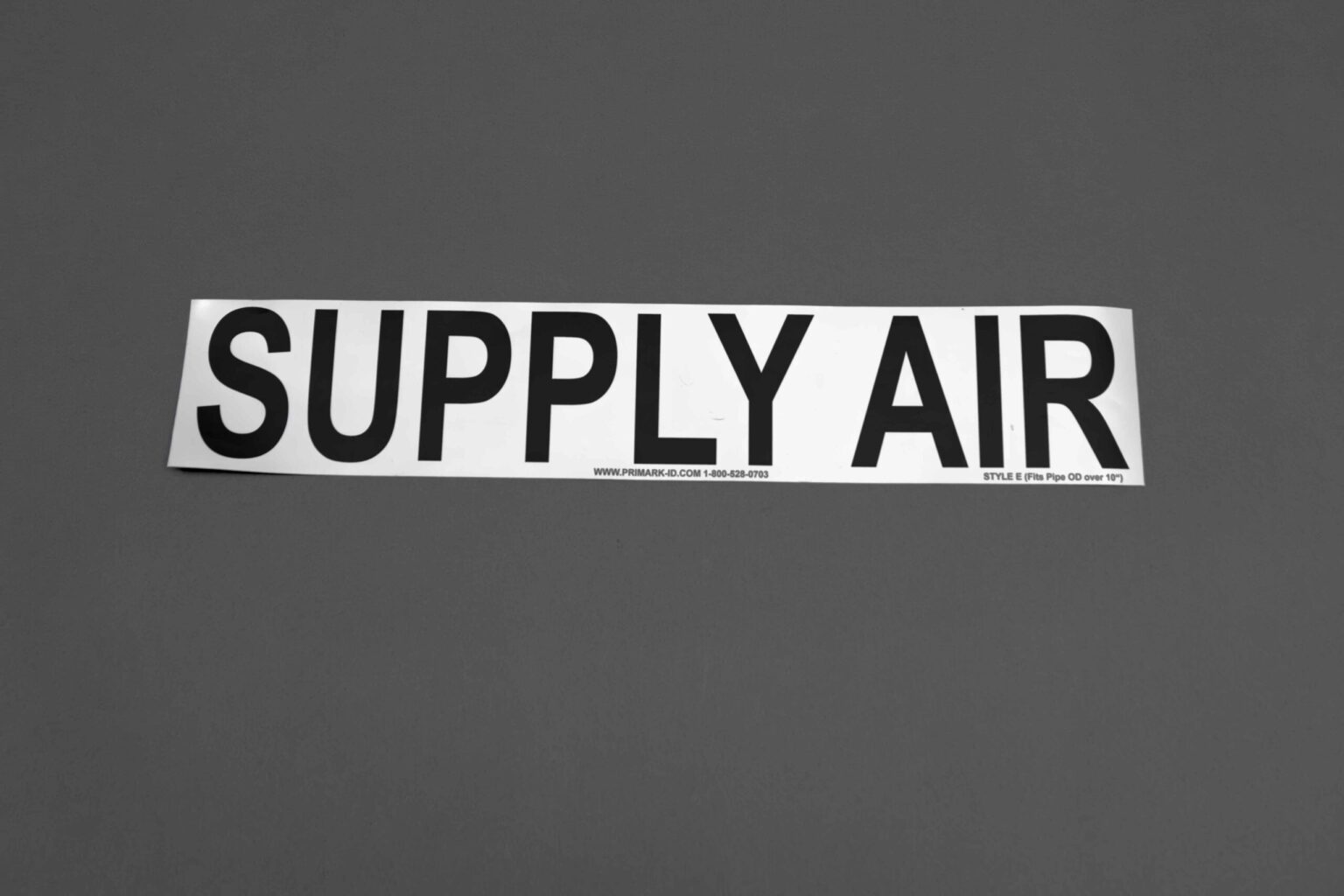 A big white sticker that reads Supply Air in bold black letters