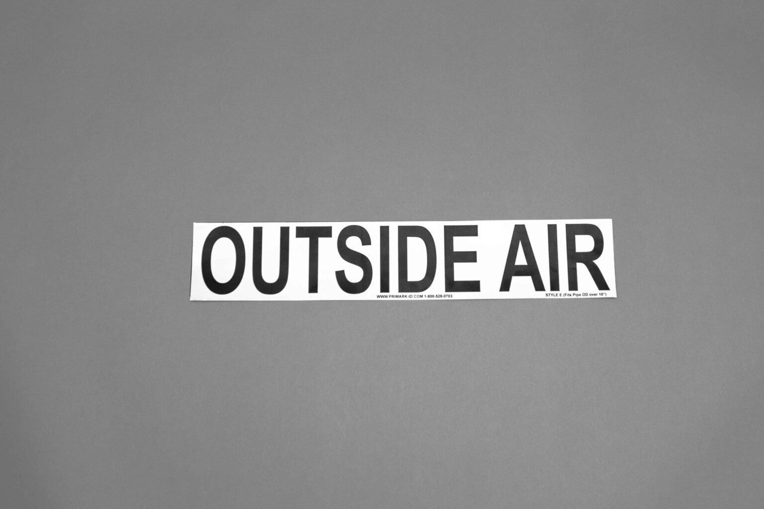 A big white sticker that reads outside air in big black letters