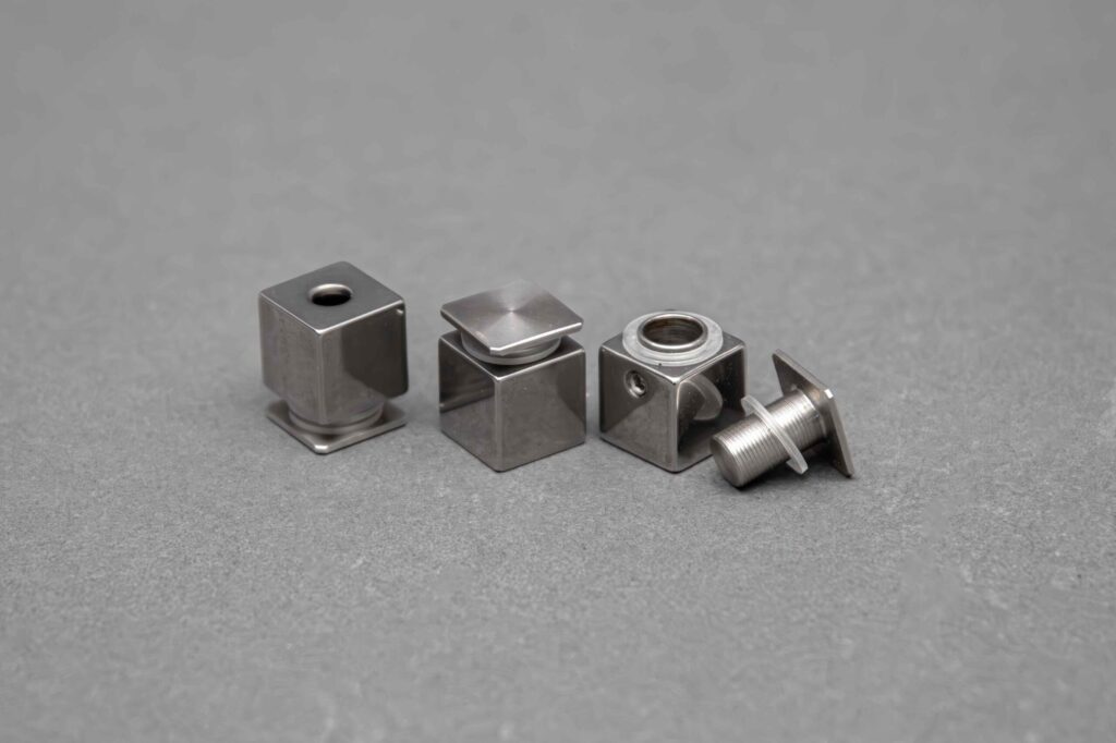 Small square boxes hold small square screws showcasing how the distance offset mounts work